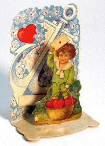Valentine pop-up of boy with basket of hearts. 
