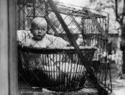 Baby in cage.
