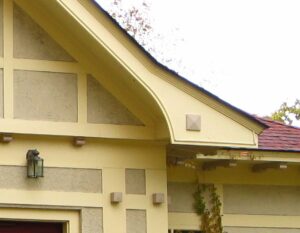 Bargeboard corner on yellow house.