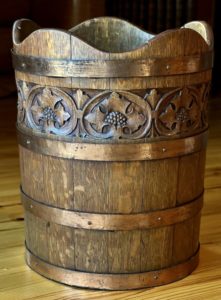 wooden bucket with carved leaves