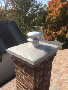 Chimney with cap and vent.