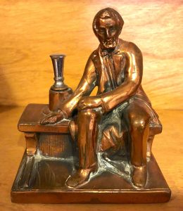 Abraham Lincoln cigarette lighter.