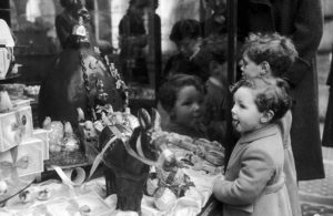 Children looking at a window display of Easter candy