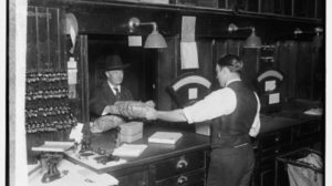 man at post office counter with package with first and second paragraphs.