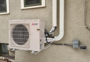 Closeup of exterior condenser unit.