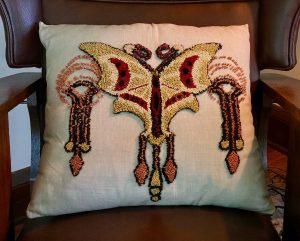 Embroidered pillow.