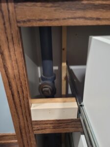 Pipe in cabinet.