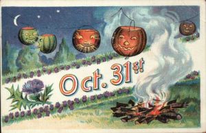 postcard with pumpkins hanging over a fire