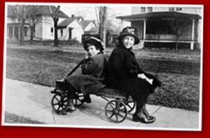 photo of two girls in wagon.