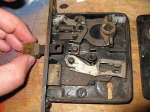 Photo of man fixing a lock.