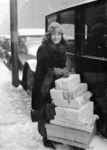 Woman with pile of packages.