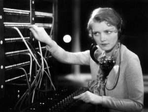 Photo of young woman switchboard operator.