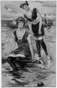 two women standing in water wearing black tights