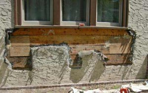 Once the window box was removed, the walls’ substructure was revealed. Two areas of rotted boards were patched.