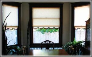 photo of scalloped shades in dining room.