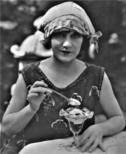 Woman eating a sundae.
