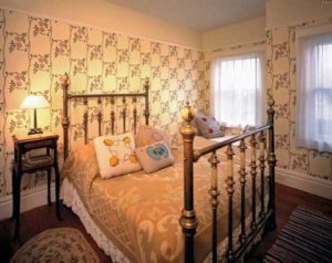 Bedroom with floral trellis wallpaper