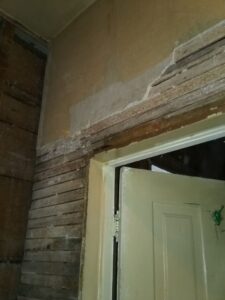 Lathe and plaster wall.