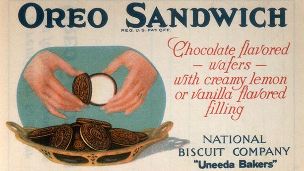 Ad of woman's hands pulling Oreo cookie apart.